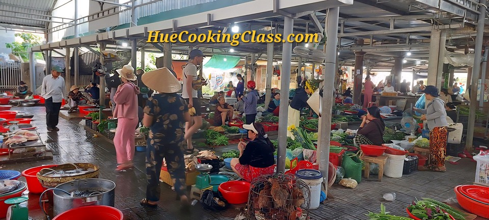 Traditional market experience before Hue cooking class in Vietnam